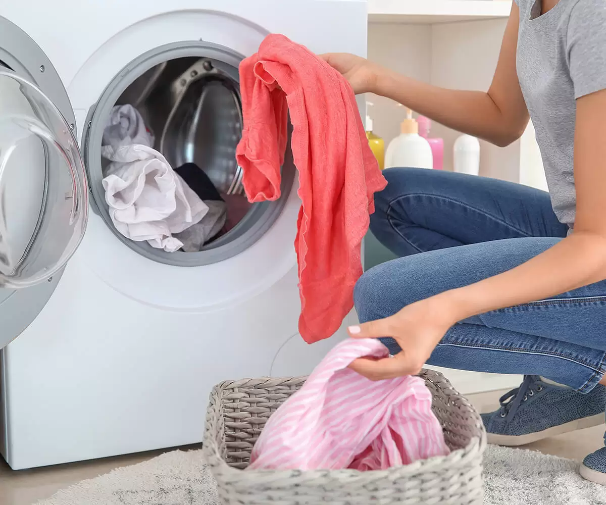 Taking clothes out of the washing machine